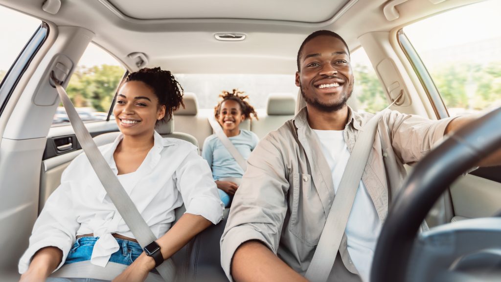 family driving together in a car